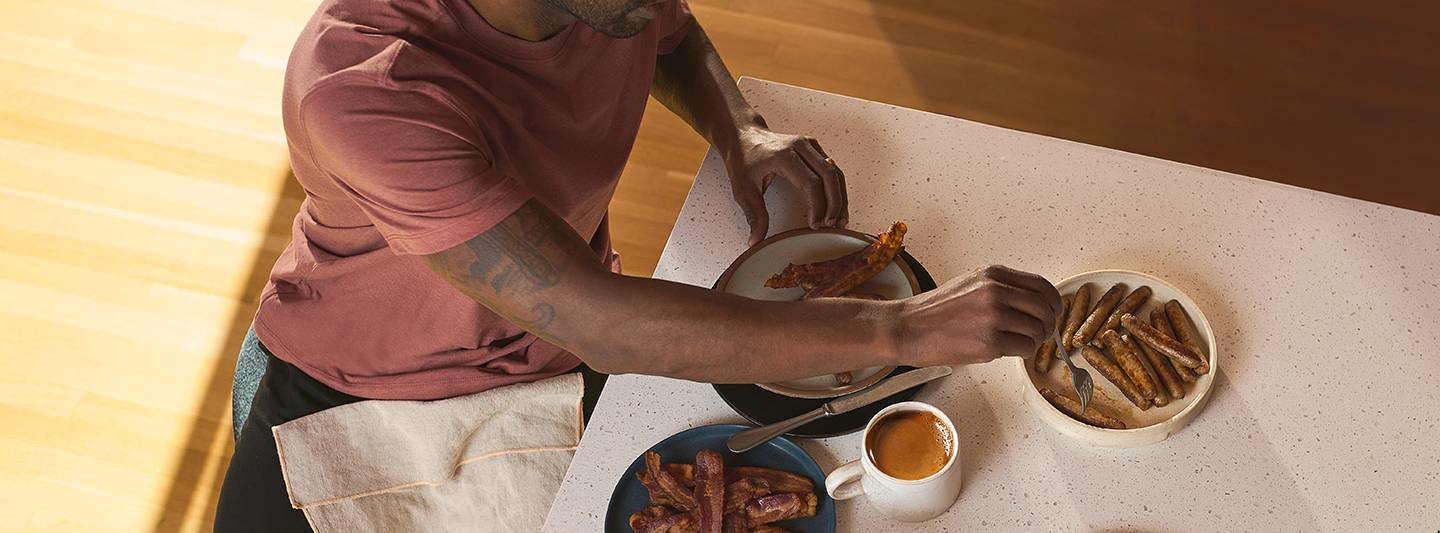 Man eating breakfast foods