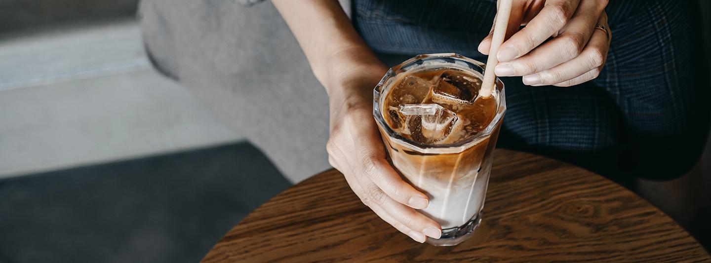 Person holding iced coffee