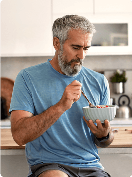 A man eating a bowl of food