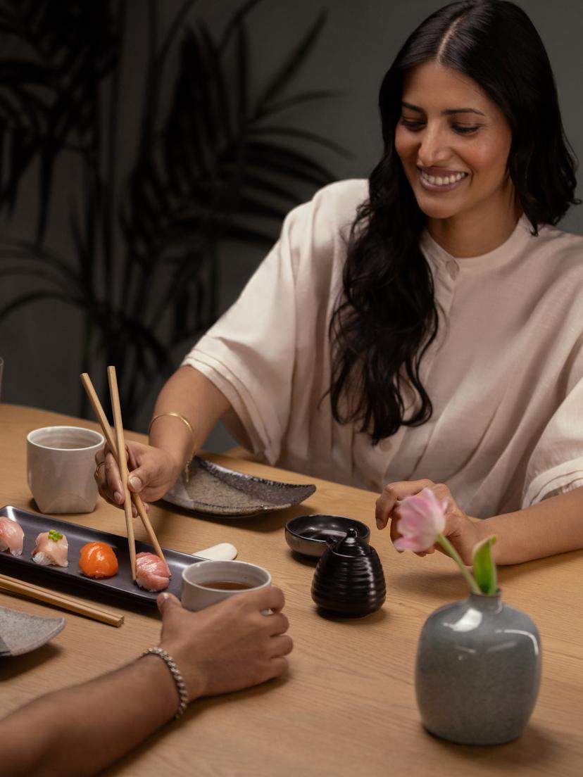 Woman eating sushi