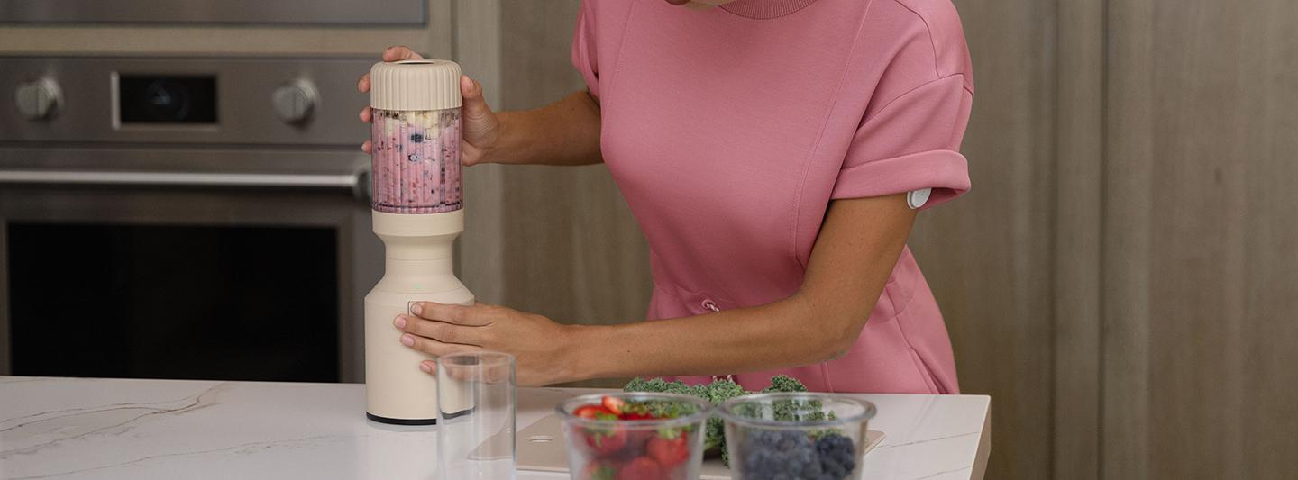 Woman making a smoothie