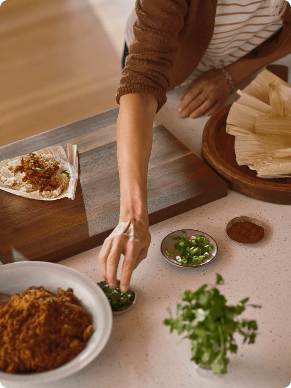 Woman's hand making tamales