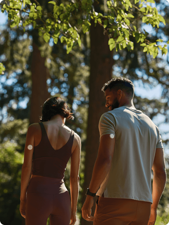 Couple walking in trees 