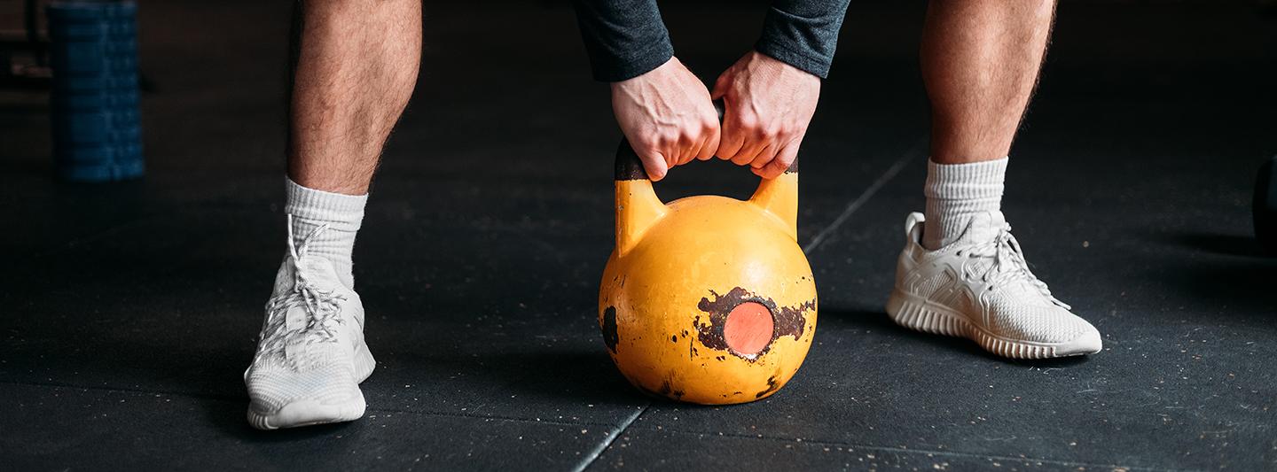 Person lifting a kettlebell