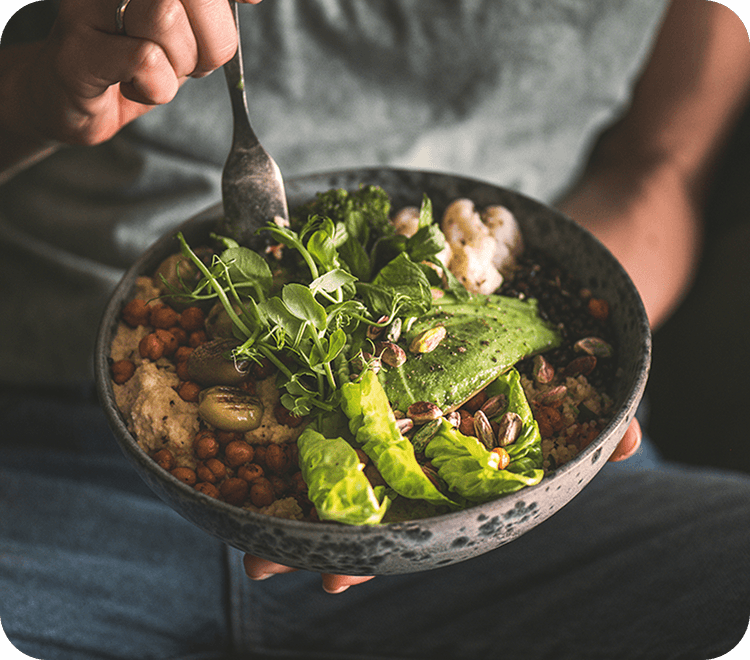 An avocado chickpea bowl with microgreens