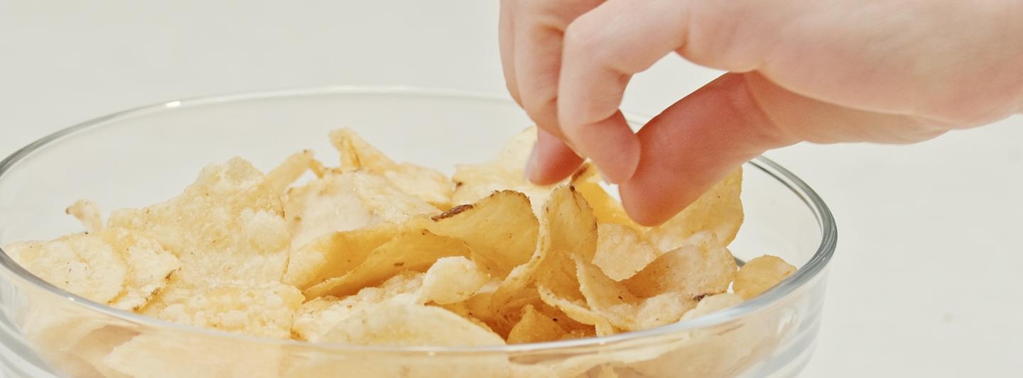 Ultra-processed potato crisps in a bowl