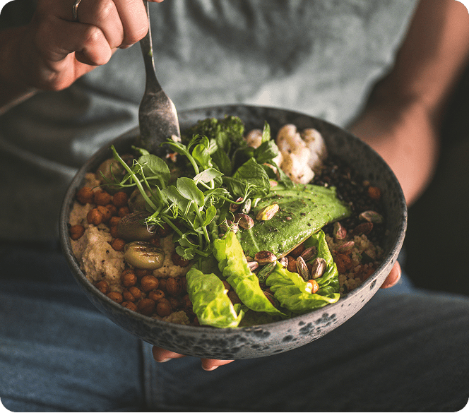 An avocado chickpea bowl with microgreens