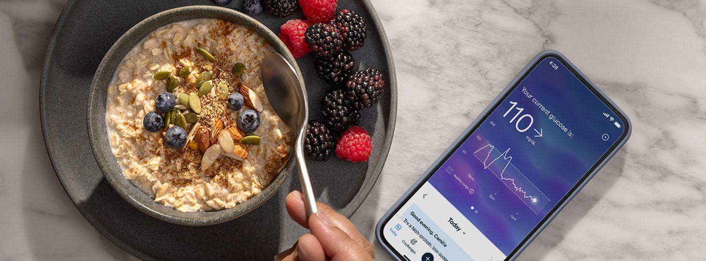 Bowl of oatmeal on table with phone showing Lingo app