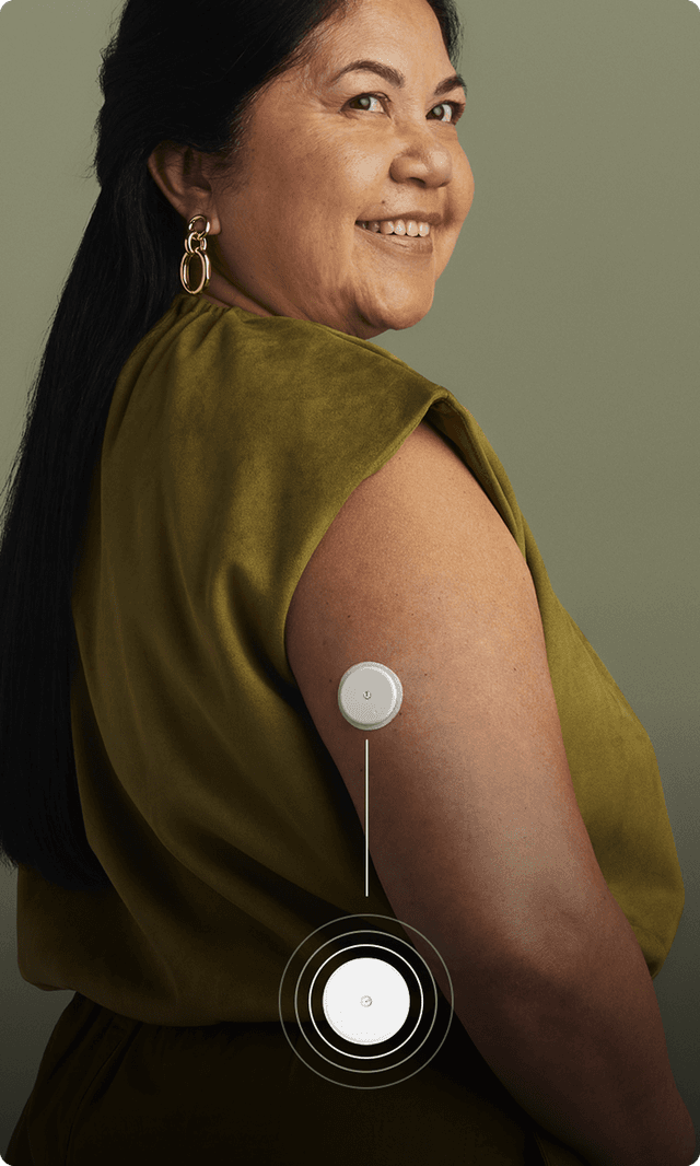 Woman in a short sleeve shirt wearing a Lingo biosensor